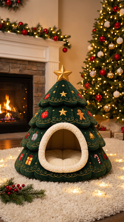 Green padded Christmas tree pet bed with a gold star and an enclosed den opening, beside a fireplace